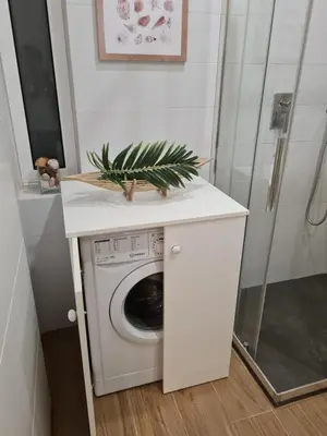 a laundry room with a washer and dryer at Victoria Studio in Vilamoura