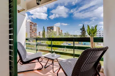 a balcony with chairs and a view of the city at Victoria Studio in Vilamoura