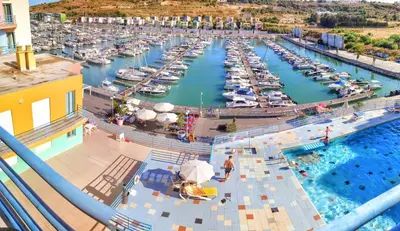 an aerial view of a marina with boats in the water at Funtastic Albufeira Marina 1b3b in Albufeira