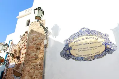 a sign on the side of a building at Charming Blue Albufeira in Albufeira