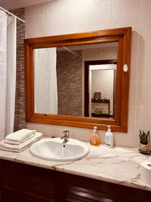 a bathroom with a sink and a mirror at Apartment Salgados T1 in Guia