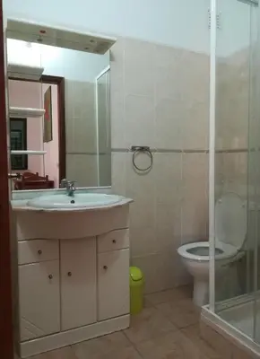 a bathroom with a sink and a toilet at Holiday House in Albufeira