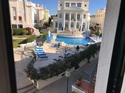 an aerial view of a house with a swimming pool at T4 Grand Townhouse Old Village in Vilamoura