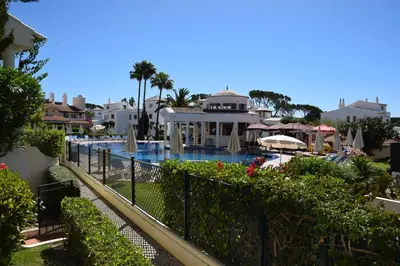 a view of a swimming pool with a resort at T4 Grand Townhouse Old Village in Vilamoura