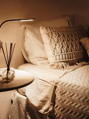 a bedroom with a bed with two lamps on it at Condominio Cerro da Guia in Guia