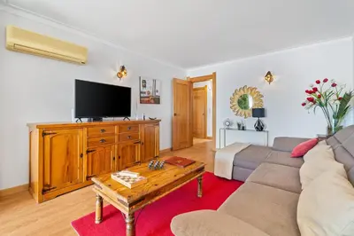 a living room with a couch and a tv at Penthouse Sea View by Albufeira Holidays in Albufeira