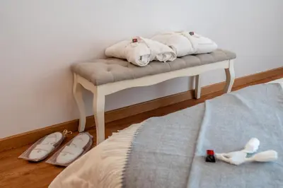 a small ottoman with towels on top of a bed at Penthouse Sea View by Albufeira Holidays in Albufeira