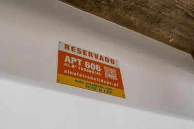 a sign hanging from the underside of a ceiling at Penthouse Sea View by Albufeira Holidays in Albufeira