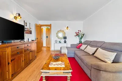 a living room with a couch and a tv at Penthouse Sea View by Albufeira Holidays in Albufeira