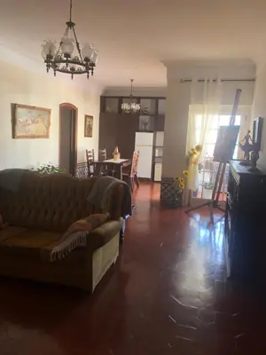 a living room with a couch and a table at Maria Guest house in Albufeira