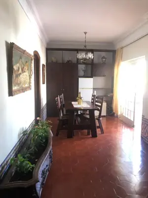 a dining room with a table and chairs at Maria Guest house in Albufeira