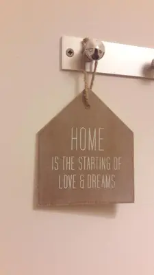 a sign that says home is the starting of love and dreams at Ritta's house in Albufeira