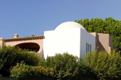 a white building with a dome on top of it at Lageado Park in Albufeira