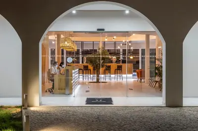 an archway leading to a dining room and kitchen in a house at Eden Villas & Apartments in Albufeira