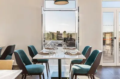 a dining room with a table and chairs at Eden Villas & Apartments in Albufeira
