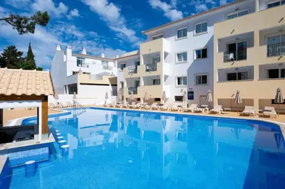 a large swimming pool in front of a building at Smy Santa Eulalia Algarve in Albufeira