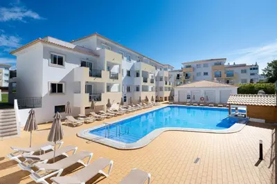 a large swimming pool in front of a building at Smy Santa Eulalia Algarve in Albufeira