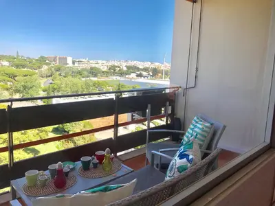 a table and chairs on a balcony with a view at Romantic Studio By Ethnic Ocean in Vilamoura