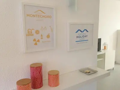 a room with two stools and two posters on the wall at Casa Montechoro in Albufeira