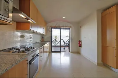 a kitchen with a stove and a counter top at Corcovada, Albufeira, Algarve in Albufeira