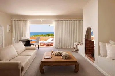 a living room with a couch and a coffee table at Vila Joya in Albufeira