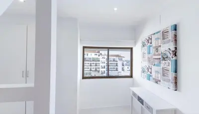 a bathroom with white walls and a window at Stay Inn Albufeira - 303B Apartment in Albufeira