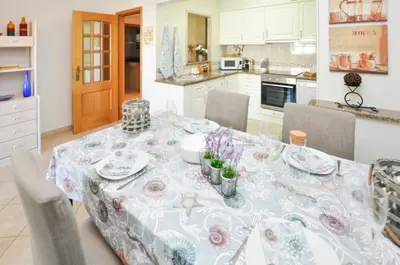 a dining room table with a blue and white table cloth at Bogart at Casablanca by OCvillas in Albufeira