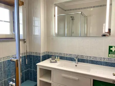 a bathroom with a sink and a mirror at Bogart at Casablanca by OCvillas in Albufeira