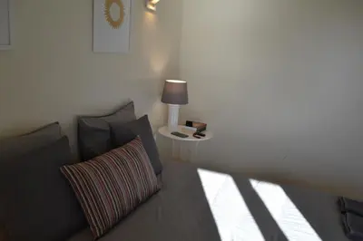 a bedroom with a bed and a table with a lamp at TP MARINA 27, Vilamoura View Apartment in Quarteira