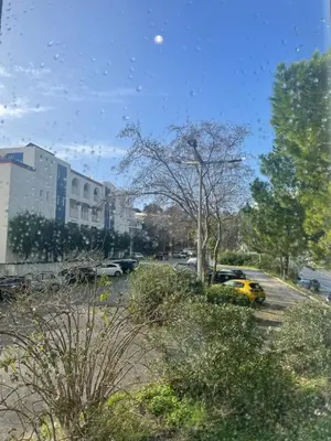 a view of a parking lot with cars parked at Bayview Apartment 213 in Albufeira