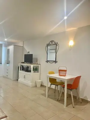 a dining room with a white table and chairs at Bayview Apartment 213 in Albufeira