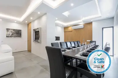 a conference room with a long table and chairs at Luxury 47 in Albufeira