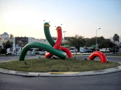 a sculpture of three flamingos in the middle of a street at Tropical Sol in Albufeira