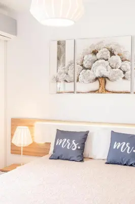 a bedroom with a bed with two pillows on it at My Place @ Faro Ria Views in Faro