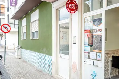 a store front with a stop sign on the door at My Place @ Faro Ria Views in Faro