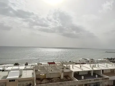 a view of the ocean from a building at Torres Mira Praia by Garvetur in Quarteira