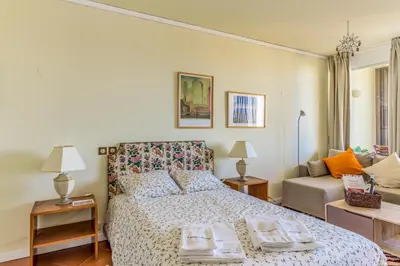 a bedroom with a bed with two trays on it at FLH Vilamoura Cozy Studio in Vilamoura