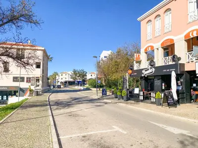an empty street in a town with a building at AL - Apartamento Vista Marina 1 in Vilamoura