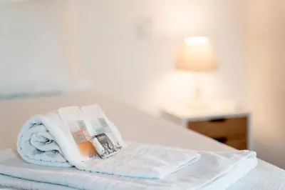 a hotel room with a towel on a bed at AL - Apartamento Vista Marina 2 in Vilamoura