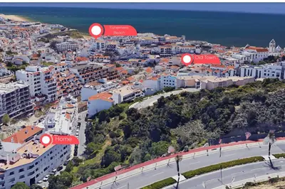 an aerial view of a city with buildings and the ocean at #001 Veríssimo Flat by Home Holidays in Albufeira