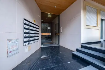 a hallway of a building with stairs and a window at #001 Veríssimo Flat by Home Holidays in Albufeira