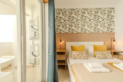 a bedroom with a bed with a wall at #001 Veríssimo Flat by Home Holidays in Albufeira