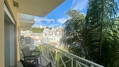 a living room with a couch and a table and chairs at Garden Hill M by Check-in Portugal in Albufeira