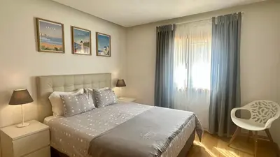 a kitchen with white cabinets and green tiles at Garden Hill M by Check-in Portugal in Albufeira