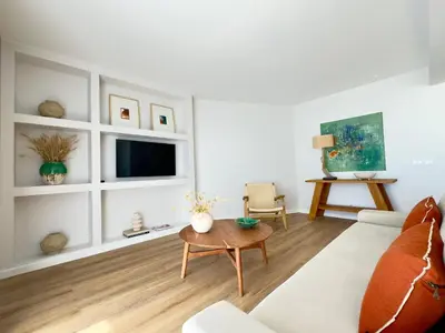 a room with white shelves with vases and a toaster at Apartamentos Rossio Mar in Albufeira