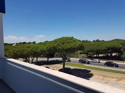 a view of a parking lot with trees and cars at Hiva T3 By FHR in Vilamoura