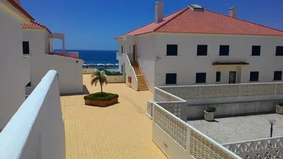 a balcony of a building with a view of the ocean at Apartamento Oura T1 Beach 200m in Albufeira