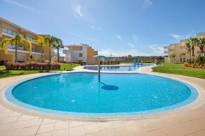 a large swimming pool in a resort at Marina Luxury Residence - Albufeira in Albufeira