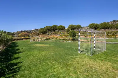 a goal in the middle of a field of grass at Marina Luxury Residence - Albufeira in Albufeira