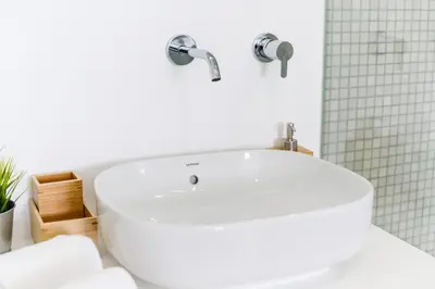 a white bath tub in a white bathroom at Casas Barulho Penthouse Old Town in Albufeira
